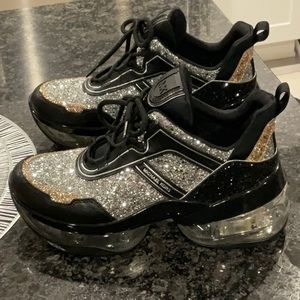 Women’s Michael Kors Olympia Extreme black sneakers with gold and silver glitter